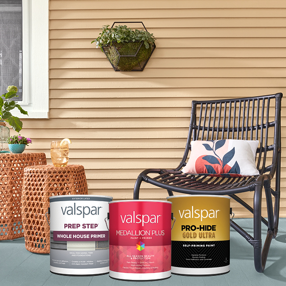 The porch of a house with a chair and tables, plus cans of Valspar Prep Step, Medallion Plus and Pro-Hide® Gold Ultra.