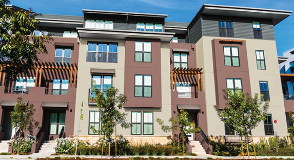 4-story attached homes with alternating Parlour Taupe and Apache Clay exterior walls and top floor exterior in Beguile.